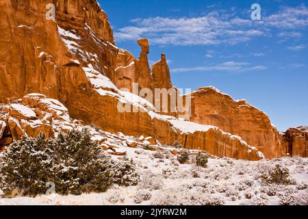 Nefertiti Rock or Queen Nefertiti on the west wall of Park Avenue in Arches National Park after a snowfall.  Moab, Utah. Stock Photo