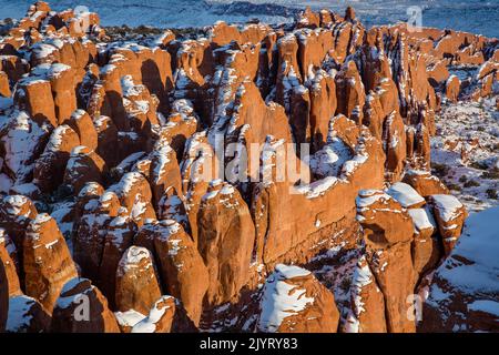 Snow-capped Entrada sandstone fins in the Fiery Furnace in winter.  Arches National Park, Moab, Utah. Stock Photo