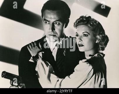 Welsh-American actor Ray Milland and actress Marjorie Reynolds in the movie Ministry of Fear, USA 1944 Stock Photo