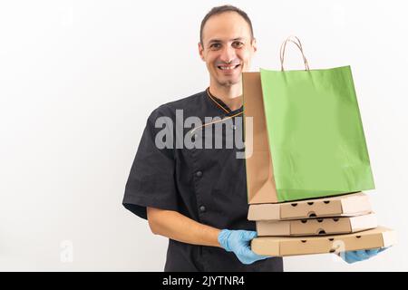 Delivery man with boxes of pizza, chef. Stock Photo