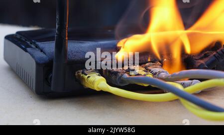 Can Routers Explode Burning Internet cable due to high congestion Stock Photo - Alamy