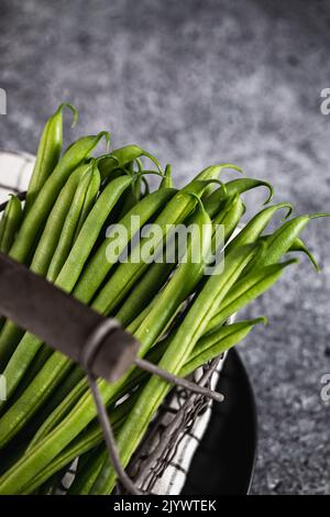 Green beans in a vintage style basket Stock Photo