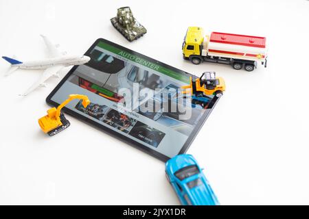 different types of toy transport and a tablet Stock Photo