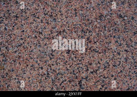 Texture and background red granite rock volcanic origin Stock Photo