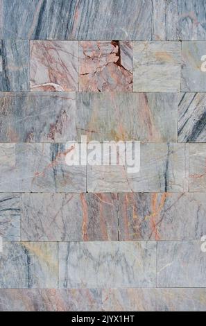 Background and texture wall finished with marble tiles Stock Photo