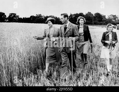 File photo dated 30/09/1942 of King George VI and Queen Elizabeth walking in a field with their daughters, Princess Elizabeth and Princess Margaret (right). The Queen died peacefully at Balmoral this afternoon, Buckingham Palace has announced. Issue date: Thursday September 8, 2022. Stock Photo