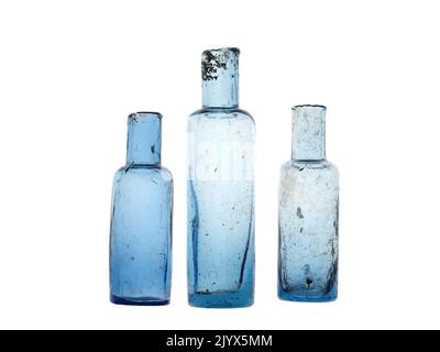 Vintage sheared lip old bottles, hand blown collectable antique. Isolated over white. Stock Photo