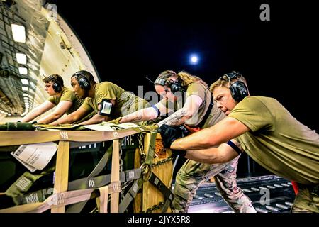 McGuire AFB, New Jersey, USA. 10th Aug, 2022. Airmen assigned to the 305th Aerial Port Squadron, upload Guided Multiple Launch Rocket System munitions onboard a Boeing 767 at Joint Base McGuire-Dix-Lakehurst, N.J., Aug. 11, 2022. The munitions cargo is part of an additional security assistance package for Ukraine. The security assistance the U.S. is providing to Ukraine is enabling critical success on the battlefield against the Russian invading force. Credit: U.S. Air Force/ZUMA Press Wire Service/ZUMAPRESS.com/Alamy Live News Stock Photo