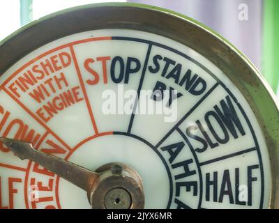 Old-fashioned nautical speed indicator or gauge on-ship, closeup showing some of the terms. Stock Photo