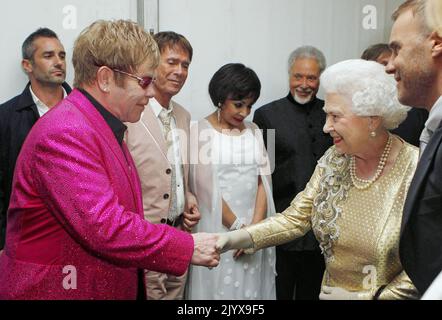 File photo dated 4/6/2012 of Queen Elizabeth II meeting Sir Elton John backstage at The Diamond Jubilee Concert outside Buckingham Palace, London. Issue date: Thursday September 8, 2022. The monarch was not fazed by celebrities and encountered hundreds of showbiz stars, pop legends and Hollywood greats over the decades, but many admitted to nerves on coming face to face with the famous long-reigning sovereign. Stock Photo