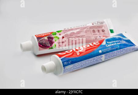 Kyiv, Ukraine - October 31, 2021: Colgate pomegranate, calcium and fluoride toothpaste packs closeup on white. Colgate is a manufacturer of a wide ran Stock Photo