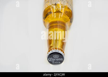Kyiv, Ukraine - November 27, 2021: Studio shoot of Corona Extra beer bottle closeup on white. Corona Extra is produced in Mexico and exported to all o Stock Photo