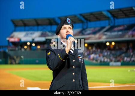 Oklahoma City, Oklahoma, USA. 26th Aug, 2022. Spc. Brittany Simmons, a vocalist with the 77th Army Band, sings 'God Bless America' during the 7th inning stretch at Chickasaw Bricktown Ballpark for OKC Dodgers Military Appreciation Night August. 26, 2022. Credit: U.S. Army/ZUMA Press Wire Service/ZUMAPRESS.com/Alamy Live News Stock Photo