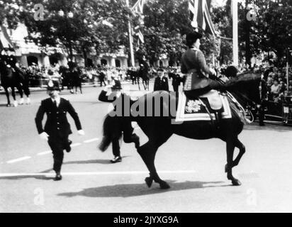 File photo dated 13/6/1981 of Queen Elizabeth II calming her horse Burmese while policeman spring to action after shots were heard as she rode down the Mall. Horses, like dogs, were the Queen's lifelong love and she had an incredible knowledge of breeding and bloodlines. Whether it was racing thoroughbreds or ponies, she showed an unfailing interest. Issue date: Thursday September 8, 2022. Stock Photo