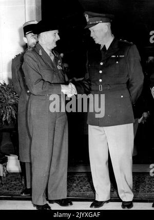 Eisenhower And Monty Meet In Paris - General Eisenhower (right) shaking hands with Field-Marshal Viscount Montgomery after the arrival of the Supreme Commander of the North Atlantic Treaty forces here. Their meeting took place at the Hotel Raphael. Figure partly hidden is that of Lt. Col. Costa de Beauregarde, the Field Marshal's aide. General Eisenhower is making a tour of the United Pact nations whose armies he will command. January 08, 1951. Stock Photo