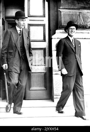 Lord Halifax And American Ambassador Smile As They Leave After Cabinet Meeting : Lord Halifax (left) and Mr. Joseph Kennedy smiling as they leave No. 10. Lord Halifax, the Foreign Minister, and Mr. Joseph Kennedy, the American Ambassador, wore broad smiles as they left No. 10, Downing Street, London, after the Cabinet meeting to consider Britain's reply to Hitler. August 27, 1939. Stock Photo