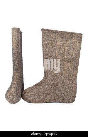 Valenki - russian felt boots on white background. Warm shoes for cold winter. Copy space. Stock Photo