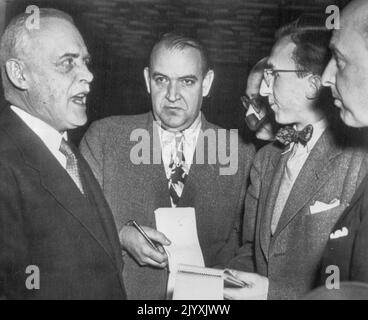 Says Radar Screen Planned - Canadian Prime Minister Louis St. Laurent (left) tells newsmen today that the Canadian and United States Governments are planning a vast Radar Interceptor Network across Northern Canada. He spoke at a conference at the Canadian Embassy. February 12, 1949. (Photo by AP Wirephoto). Stock Photo