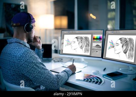 Graphic Designer Working Late At Night In Office Stock Photo