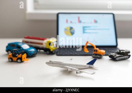 Tablet computer with different types of toy transport. auto center Stock Photo