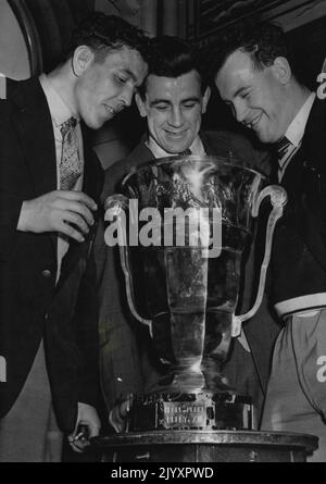 The World Cup. Sam Smith, David Valentine (Captain) and John ***** members of the Great Britain Rugby League team, ***** World Cup they brought back with them from France, ***** victory. November 15, 1954. (Photo by Daily Mail Contract Picture). Stock Photo