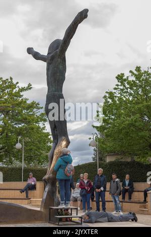 Medjugorje, Bosnia and Herzegovina - April 23rd, 2022 - Worshipper surround the statue of Christ in Medjugorje where the fluid weeping from the statues Stock Photo