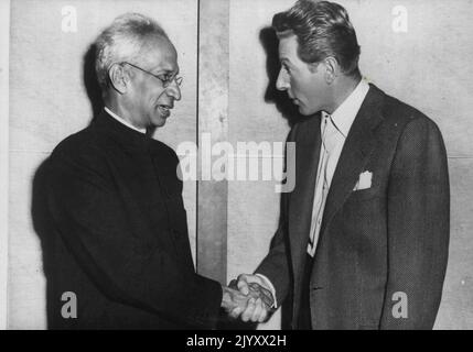 The Vice President of India Meets Danny Kaye - Dr. Radhakrishnan shaking hands with Danny Kaye, the famous screen actor, during his visit. Dr. S. Radhakrishnan, Vice President of India, was the guest at a luncheon given by the Association of Motion Picture Producers in Hollywood during his visit to the U.S.A. After the luncheon the Vice-President made a tour of the Paramount Studios. July 14, 1953. Stock Photo