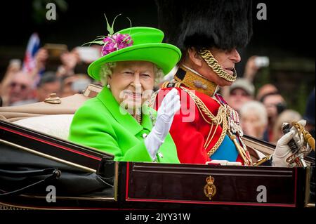 London, UK. 8 September 2022. FILE PHOTO Queen Elizabeth II, Britain's longest reigning monarch has died aged 96.  Photo taken 20 April 2016 shows The Queen and Prince Philip passing by along The Mall, riding in an open-top, horse drawn carriage during Trooping of the Colour on The Queen's 90th birthday. Credit: Stephen Chung / Alamy Live News Stock Photo