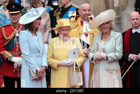 File photo dated 19/4/2011 of Queen Elizabeth II flanked by Carole Middleton (left) and the Duchess of Cornwall after the wedding of the duke and Duchess of Cambridge at Westminster Abbey. Issue date: Thursday September 8, 2022.