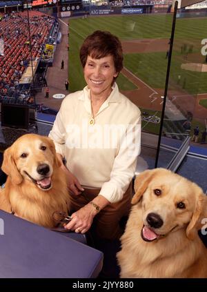 Judy Kessler, wife of NY Mets owner Fred Wilpon with her two Golden Retrievers in the owner’s box of Shea Stadium in 2006. Stock Photo
