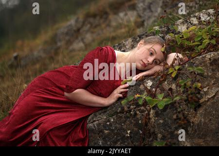 September 2022 - Young woman in period costume suitable for romantic novels and book covers Stock Photo