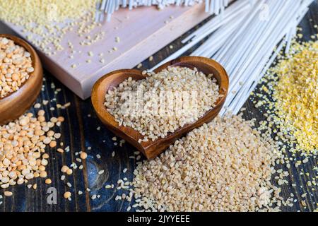 Fresh uncooked bulgur porridge on the table, cooking dishes from traditional eastern bulgur cereals Stock Photo