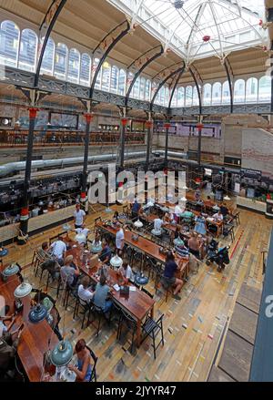 Mackie Mayor interior, communal dining tables, informal food court, Smithfield Market Hall, 1 Eagle St, Manchester M4 5BU Stock Photo