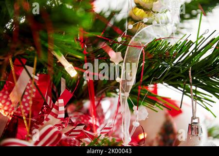 Abstract New Year tree background with ribbons, garland and shiny lights. Christmas backdrops Stock Photo