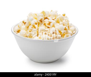 Popcorn in a white bowl placed on a white background. Stock Photo