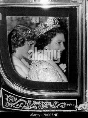 Jul. 07, 1983 - London, England, United Kingdom - PRINCESS DIANA, left, took a rare back seat when she accompanied QUEEN ELIZABETH, right, riding in the horse-drawn coach on their way to the State Opening of Parliament. But just a few hours later, Diana was back in the centre of attention when she called on a meeting of playgroup organizers. She has been interested in playgroups since she worked in one for several years. (Credit Image: © Keystone Press Agency/ZUMA Press Wire) Stock Photo
