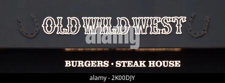 Old Wild West, logo on a facade. Burgers and Steak House. Stock Photo