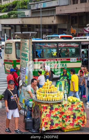 Colombia, Medellin - selling goods on the street from a wheeled cart is a common way of earning some money. Stock Photo