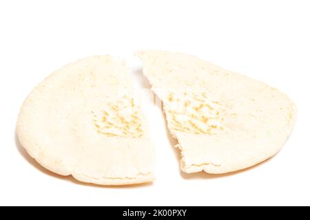 Pita bread broken in half isolated on white background. National cuisine. Healthy eating. Vegetarian food Stock Photo