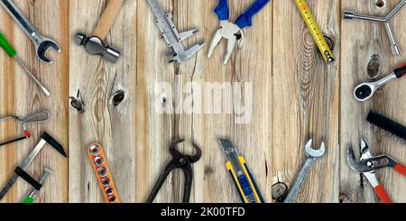 Topview of Different Work Tools on Wood Background- Stock Photo Stock Photo