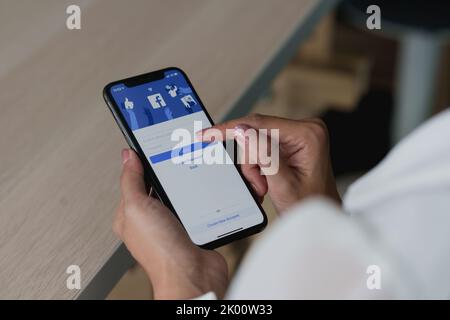 CHIANG MAI, THAILAND - SEP 09, 2022 : A man holds Apple iPhone 6S with facebook application on the screen.facebook is a photo-sharing app for Stock Photo