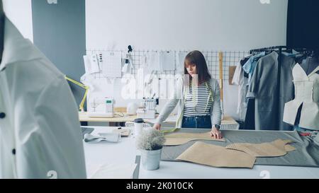 Concentrated Seamstress Putting Textile Table Measuring Tape Creation  Clothes Atelier Stock Photo by ©amixstudio 201120288