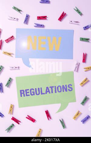 Hand writing sign New RegulationsRegulation controlling the activity usually used by rules.. Conceptual photo Regulation controlling the activity Stock Photo