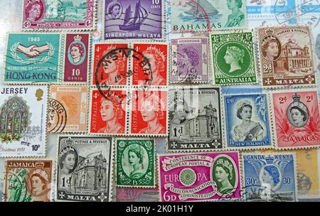 Commonwealth & British Empire stamps from many nations and countries bearing queen Elizabeth's head over the years ER Stock Photo