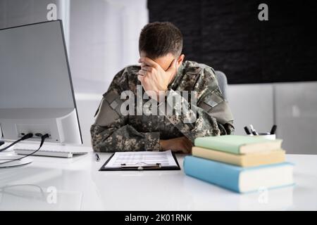 Sad Frustrated Military Veteran Student Doing Test In College Stock Photo