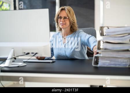 Digital Transformation. Accountant Using E Invoice Tax Document Software Stock Photo