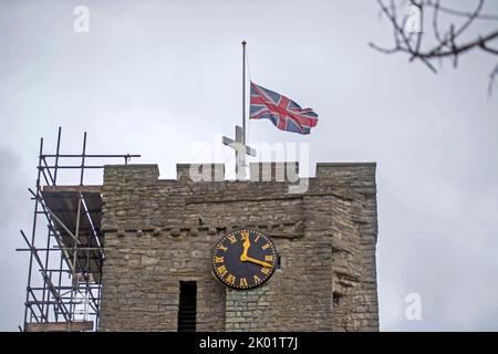 Swansea, UK. 09th Sep, 2022. The Union Jack is flown at half mast on top of the bell tower of All Saints Church in Mumbles, Swansea this atfernoon as a mark of respect for Queen Elizabeth The Second who died yesterday at the age of 96. The church is also tolling its bell to mark the event. Credit: Phil Rees/Alamy Live News Stock Photo