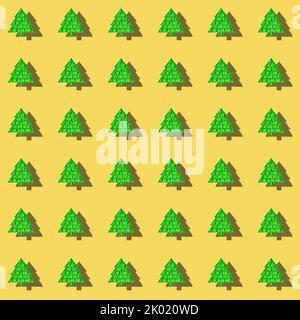 Festive Xmas seamless pattern of popular child anti stress pop it toy in form of green Christmas tree on yellow. Holiday image with kids dimple toys w Stock Photo