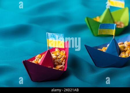 Ships with Ukrainian maize grain made of paper concept Stock Photo