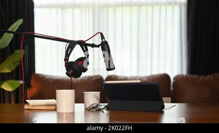 Professional condenser microphone, laptop and headphone. Entertainment, podcasts and technology concept Stock Photo